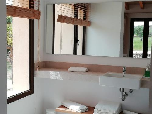 a bathroom with a sink and a mirror at son capellot in Felanitx