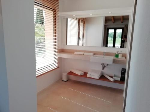 a bathroom with a sink and a mirror at son capellot in Felanitx