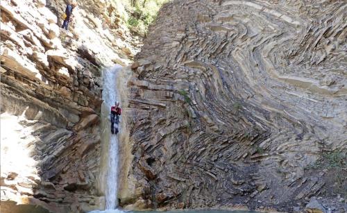 a group of people standing on top of a waterfall at Anayet Sweet Home in Formigal
