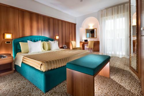 Postel nebo postele na pokoji v ubytování Milano Resort