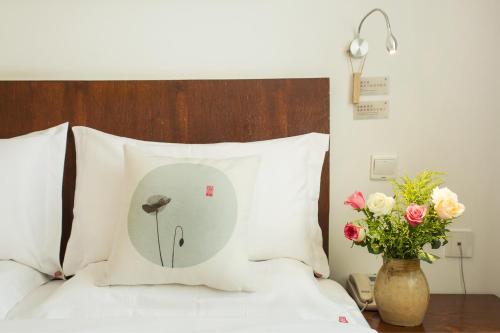 Dali Yanyuan Mountain Retreatにあるベッド