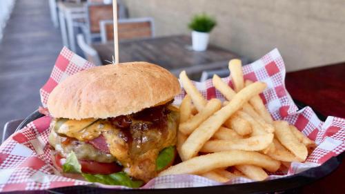 a sandwich and french fries in a basket at Argyle Hotel Southern Highlands in Moss Vale