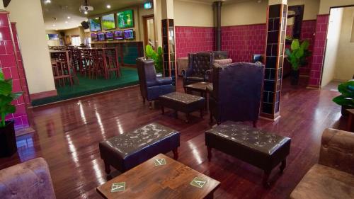 an overhead view of a bar with chairs and tables at Argyle Hotel Southern Highlands in Moss Vale