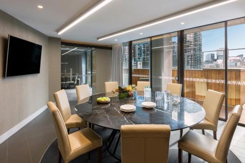 a dining room with a table and chairs at Imagine Marco in Melbourne