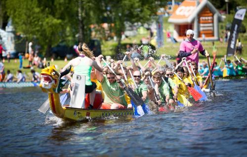 a group of people on a boat in the water at Apartmán Riviéra Lipno 510/21 in Lipno nad Vltavou