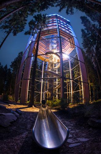 a glass house with a bell in front of it at Apartmán Riviéra Lipno 510/21 in Lipno nad Vltavou
