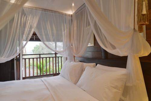 Katil atau katil-katil dalam bilik di Chantra Khiri Chalet Chiang Mai