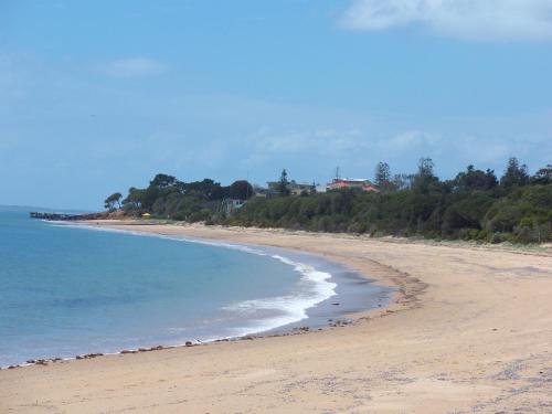 a view of a beach with the ocean at NRMA Phillip Island Beachfront Holiday Park in Cowes