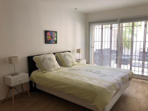 Ένα ή περισσότερα κρεβάτια σε δωμάτιο στο Clos Des Plages Maison De Vacances