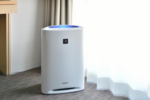 a white cpu sitting on the floor in a room at Kyoto Tokyu Hotel in Kyoto