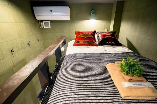 Ένα ή περισσότερα κρεβάτια σε δωμάτιο στο IKIDANE Residential Hotel Komagome