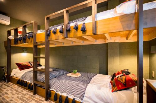 Ένα ή περισσότερα κρεβάτια σε δωμάτιο στο IKIDANE Residential Hotel Komagome