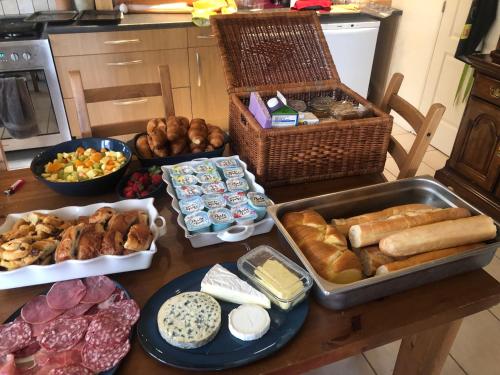 a table with many different types of food on it at Loire Escapes - Le Grenier in Berrie