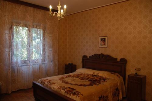 Postel nebo postele na pokoji v ubytování Agriturismo Le Rose