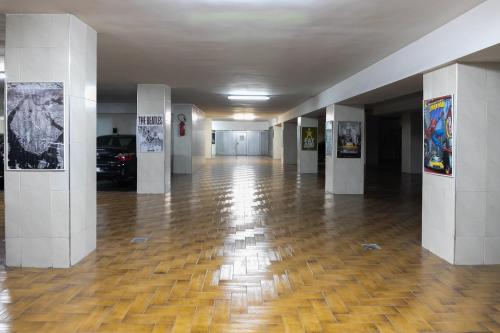 a hallway of a building with a wooden floor at Hôtel Tanjah Flandria in Tangier