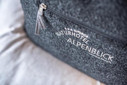 a close up of a black bag with a zipper at Naturhotel Alpenblick in Maurach