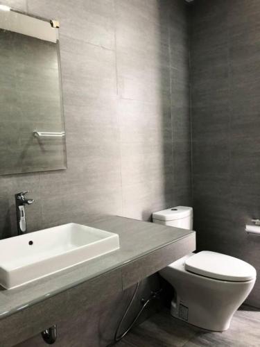 a bathroom with a white sink and a toilet at TEAK VILLA in Bangna