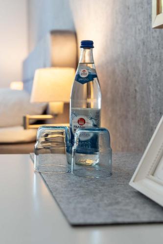 a bottle of water sitting on top of a counter at Hotel Am Dom in Bamberg