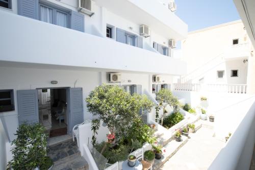 an aerial view of a white building with trees and plants at Zacharakis Studios in Kamari