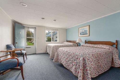 Postel nebo postele na pokoji v ubytování Ne'r Beach Motel