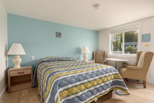 Postel nebo postele na pokoji v ubytování Ne'r Beach Motel