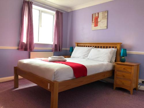 a bedroom with a bed with a teddy bear on it at Florence Court Andover in Andover