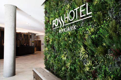 a wall covered in green plants in a lobby at Fosshotel Reykjavík in Reykjavík