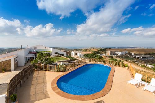 a villa with a swimming pool and views at Agroturismo Son Vives Menorca - Adults Only in Ferreries