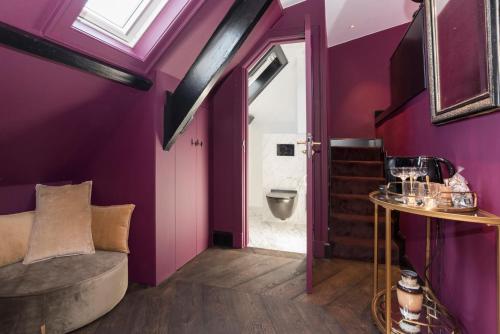 a bathroom with a toilet and a sink at New Amsterdam Harlem Hotel in Haarlem