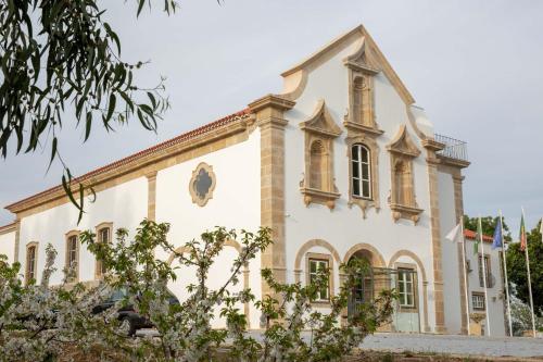 an old building with a church at Convento do Seixo Boutique Hotel & Spa in Fundão