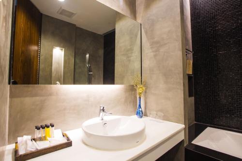 Koupelna v ubytování NAI YA Hotel -SHA Extra Plus