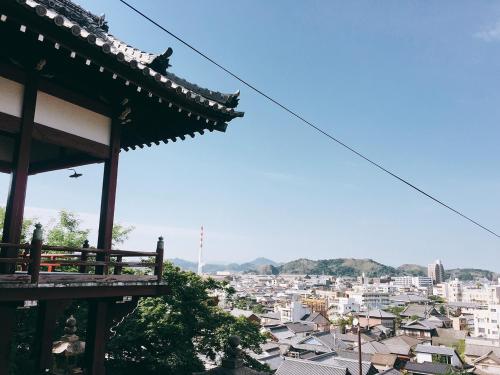 a view of a city from a roof of a building at NIPPONIA HOTEL Takehara Saltworks Town in Takekara