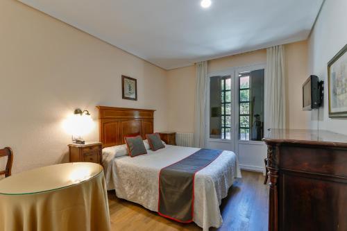 Cama o camas de una habitación en Hotel Santillana