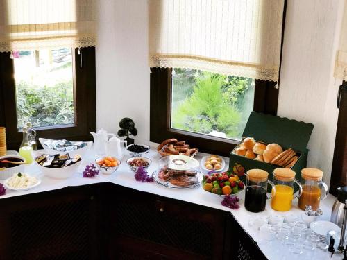 a table with many different types of food on it at Nehir Dalyan Boutique Otel in Ortaca