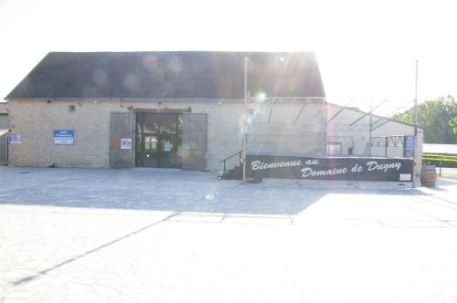 a building with a sign on the side of it at BVCO LOCATIONS PROCHE CHATEAUX ET BEAUVAL DANS LE LOIR et CHER in Onzain