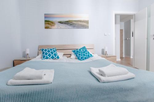 Ένα ή περισσότερα κρεβάτια σε δωμάτιο στο Resort Apartamenty Klifowa Rewal 22