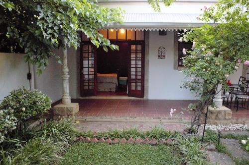 a front porch of a house with a door at The Well guesthouse/Retreat in Kroonstad