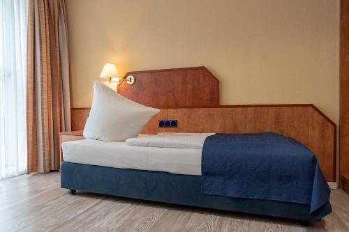 Ένα ή περισσότερα κρεβάτια σε δωμάτιο στο Boardinghouse Burgpark