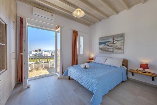 Кровать или кровати в номере Jewel Apartments Mykonos