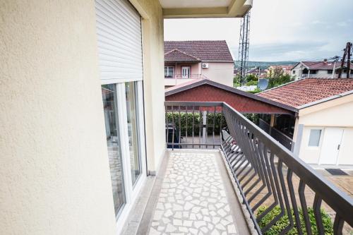 a balcony with a view of a house at Castelomi in Podgorica