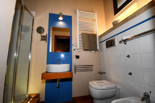 a bathroom with a sink and a toilet at Antichi Quartieri in Piazza Armerina