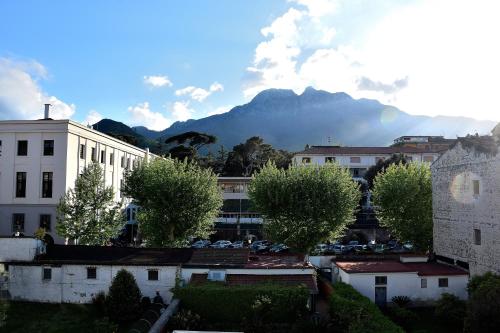 a view of a city with a mountain in the background at Le Suite del Duomo in Cava deʼ Tirreni