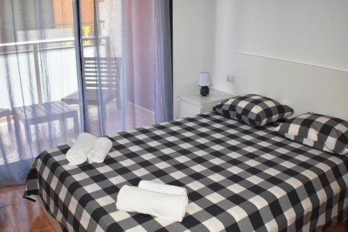 Llit o llits en una habitació de Apartament Sergi
