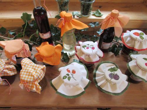 a table topped with plates and bottles of wine at Grillinghof in Kirchberg in Tirol