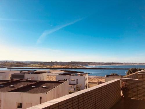a view of a city with a body of water at Apartamento Ruy Belo - Foz in Vila do Conde