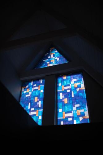 a window in a room with a blue at Bella Blue Guesthouse in Bloemfontein