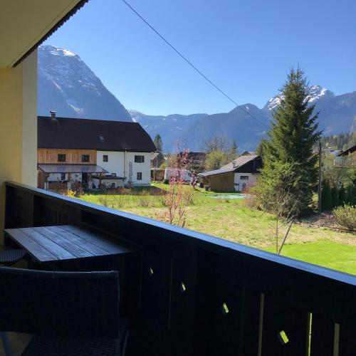 a balcony with a view of a snow covered mountain at Landhaus Lilly in Obertraun