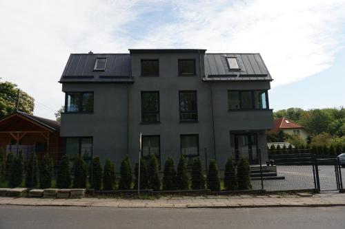 a house with a solar roof on a street at Villa Centrum in Gdańsk