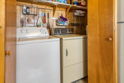 a laundry room with a washer and dryer in it at Nautical North in Ocean City