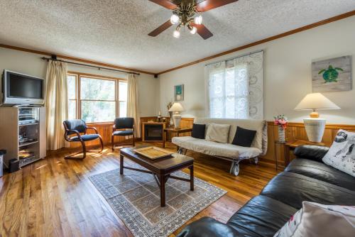 a living room with a couch and a table at Nautical North in Ocean City
